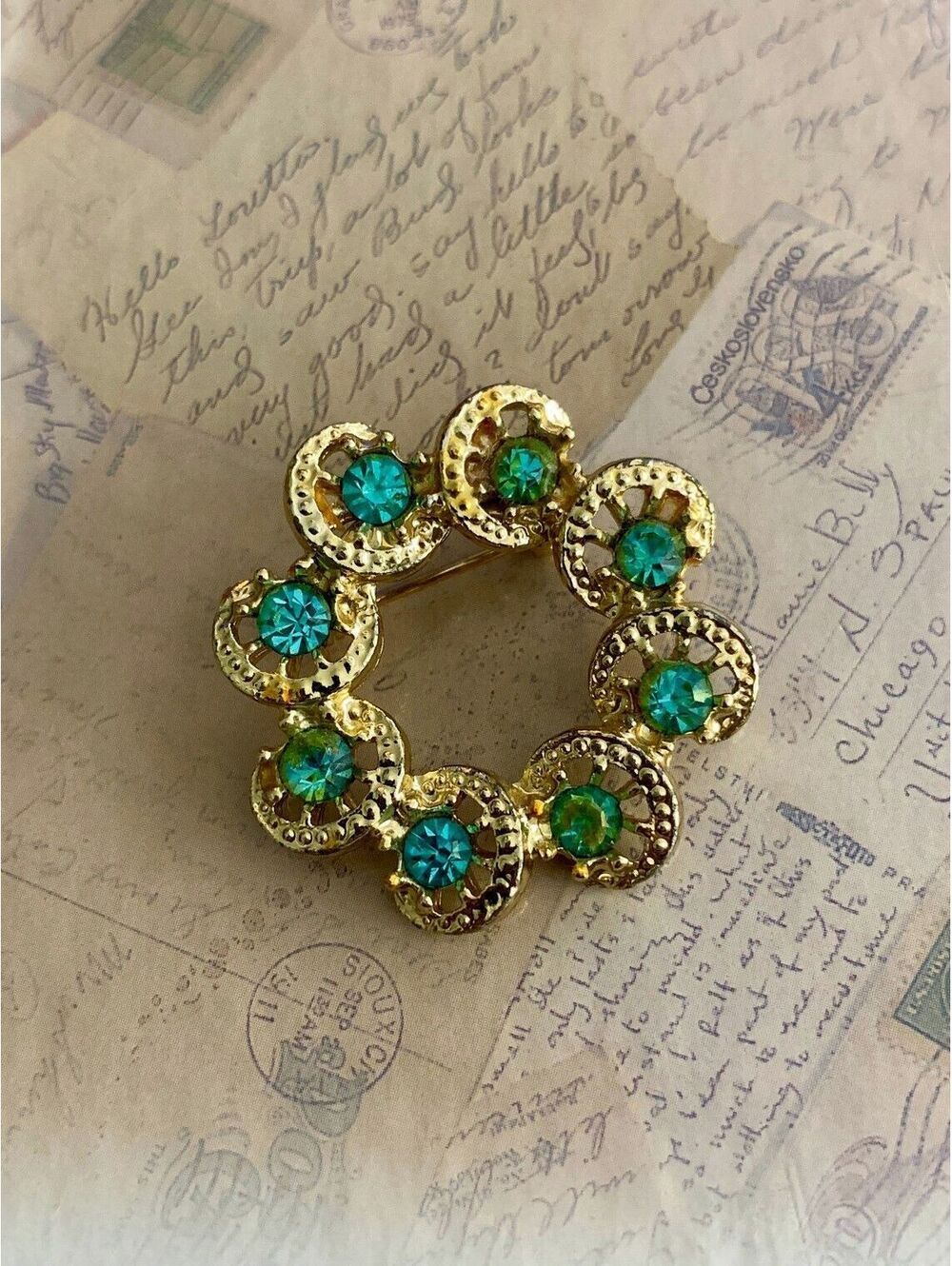 Vintage Sparkling Gold Circle Brooch with Teal Rhinestones Elegant Statement Pin